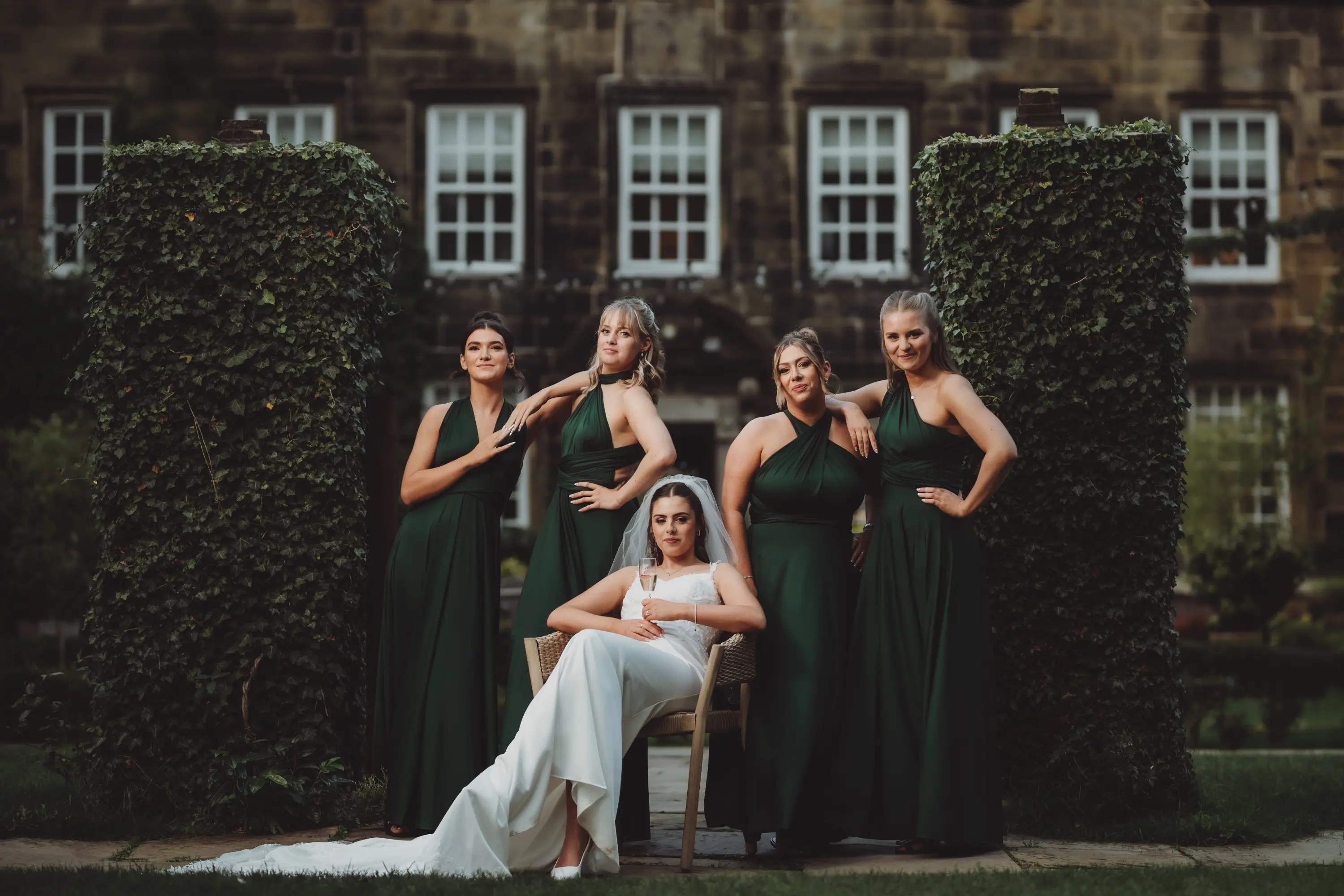 Bride and groom in front of ivy-covered Whitley Hall, Sheffield, photographed by Photogenick